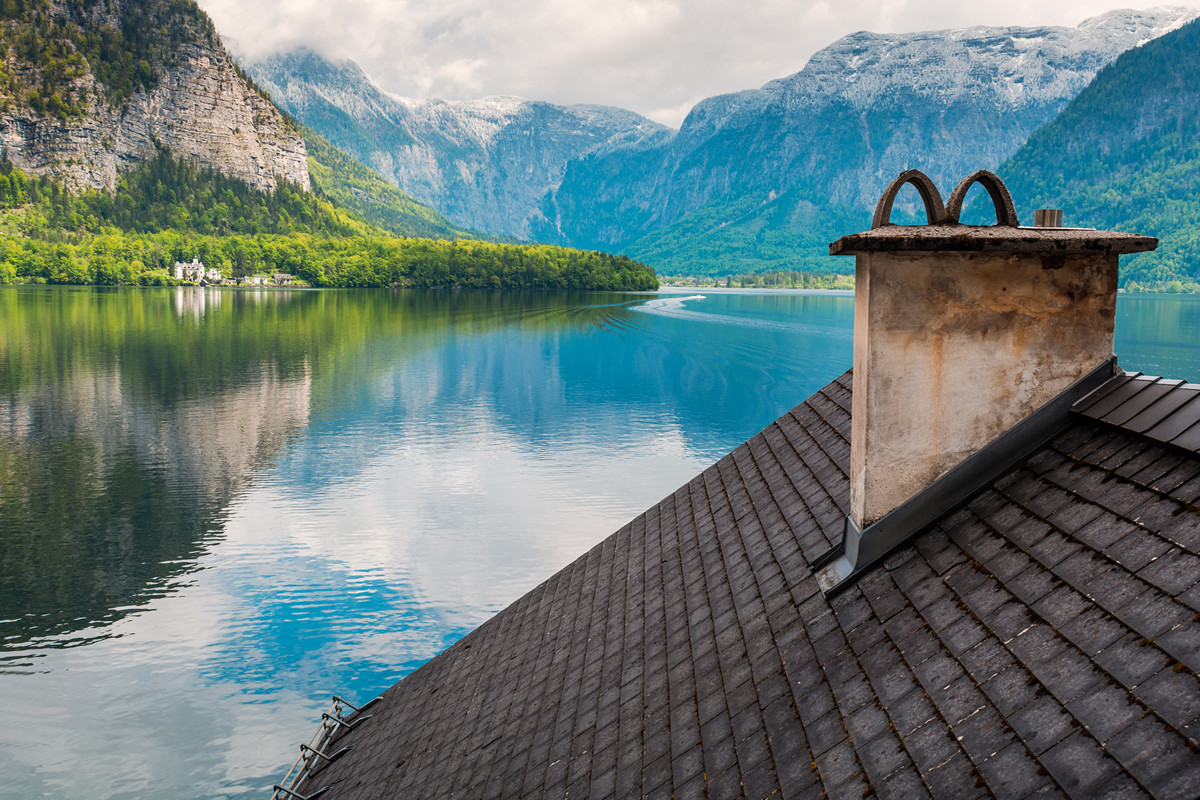 Roof and mountain lake in Hallstatt village. Tirol, Austria