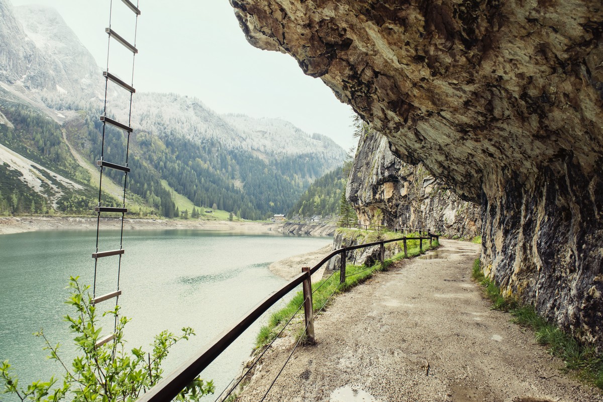 Landscape with road through the tunnel, over canyon near mountain lake Gosau, Austria