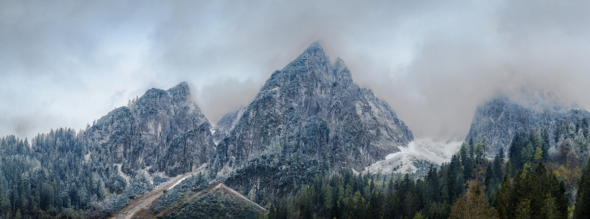 Panoramic view on Dachstein Mountains with melted snow cover. Austria, Alps, Gosau