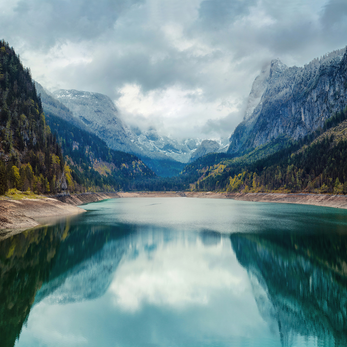 Alpine lake with dramatic sky and mountains. UNESCO heritage site. Gosausee, Tirol, Austria