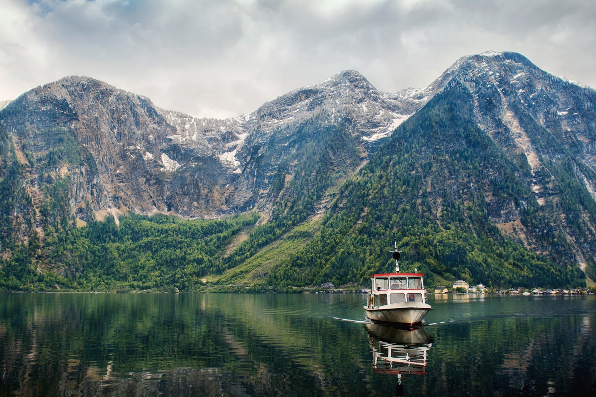 Panorama of Hallstatt lake with board in the mountain on background